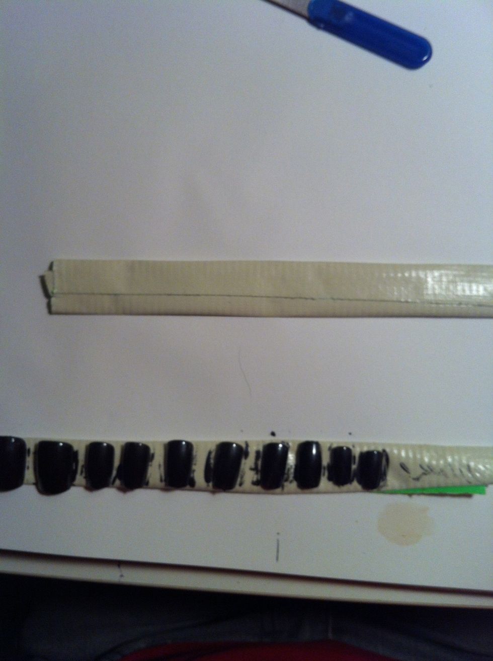 Then stick it to the paper and press it down to where it's pretty flat. You can see below, I made one for my cosplay's nails. (: