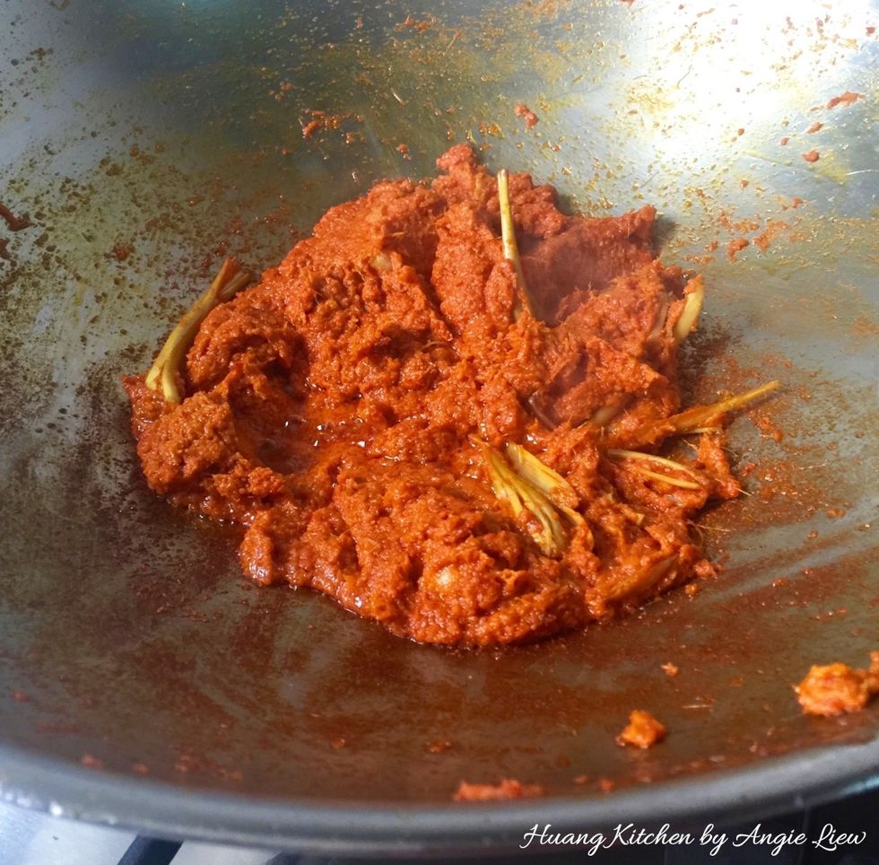 Then stir fry with the red chilli & yellow onion paste. Mix the spice together. Continue to saute for 5-10 minutes until aromatic & oil begins to separate & the paste has darken considerably.