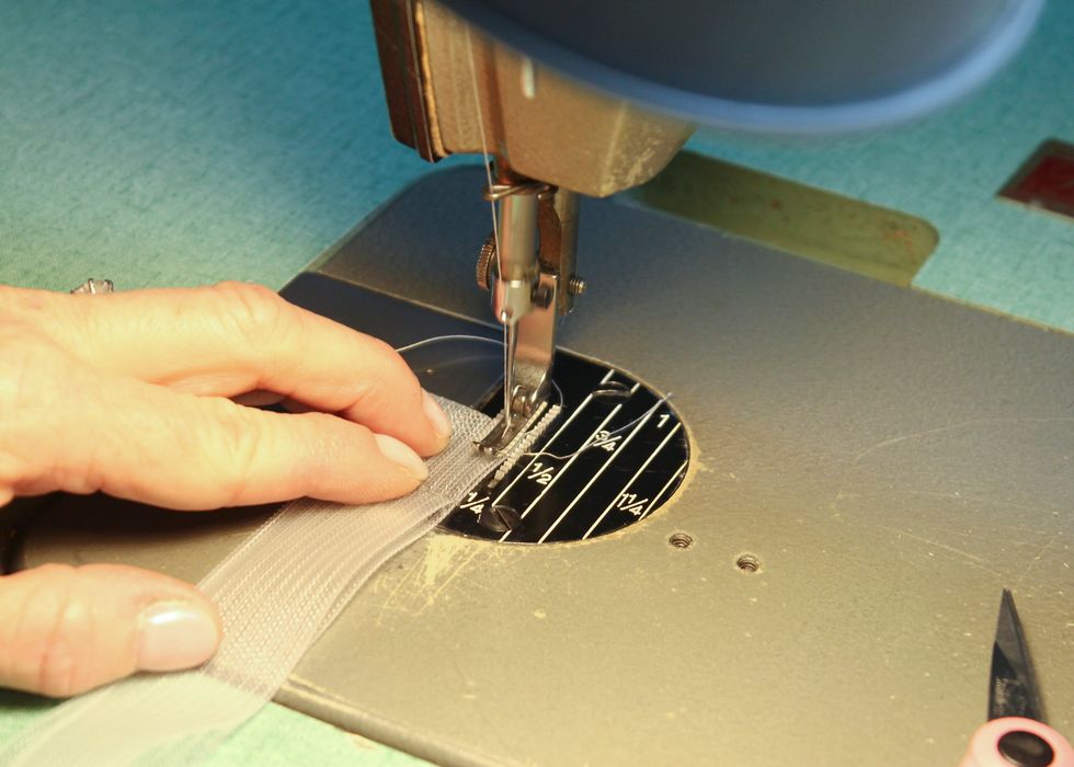 Then stitch all of the right sides of each tab to encase the magnets, leaving the left side open to slip the magnets in.