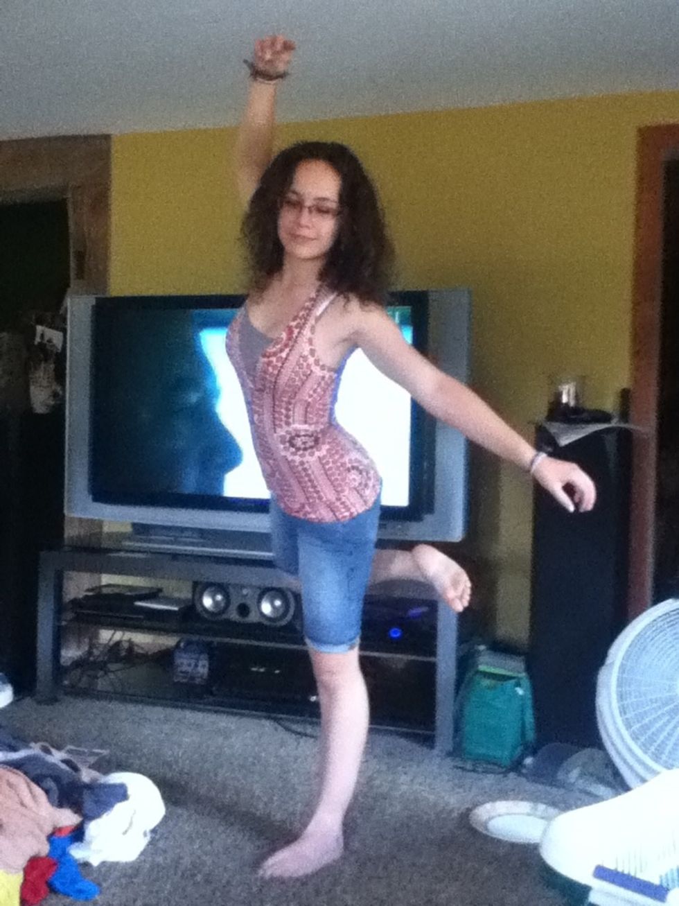 Then swing your right arm and leg around so that your arm is above your head and your leg is behind you.