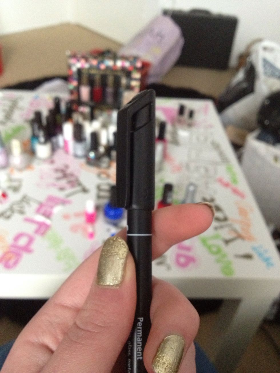 Then take a marker, a black thin one is best