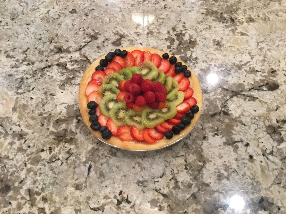 Then, take a pastry brush (the brush is used just to lightly coat the tart, not to dissolve the tart in glaze), and brush the glaze over the tart, and then refrigerate the tart for about 25 minutes.