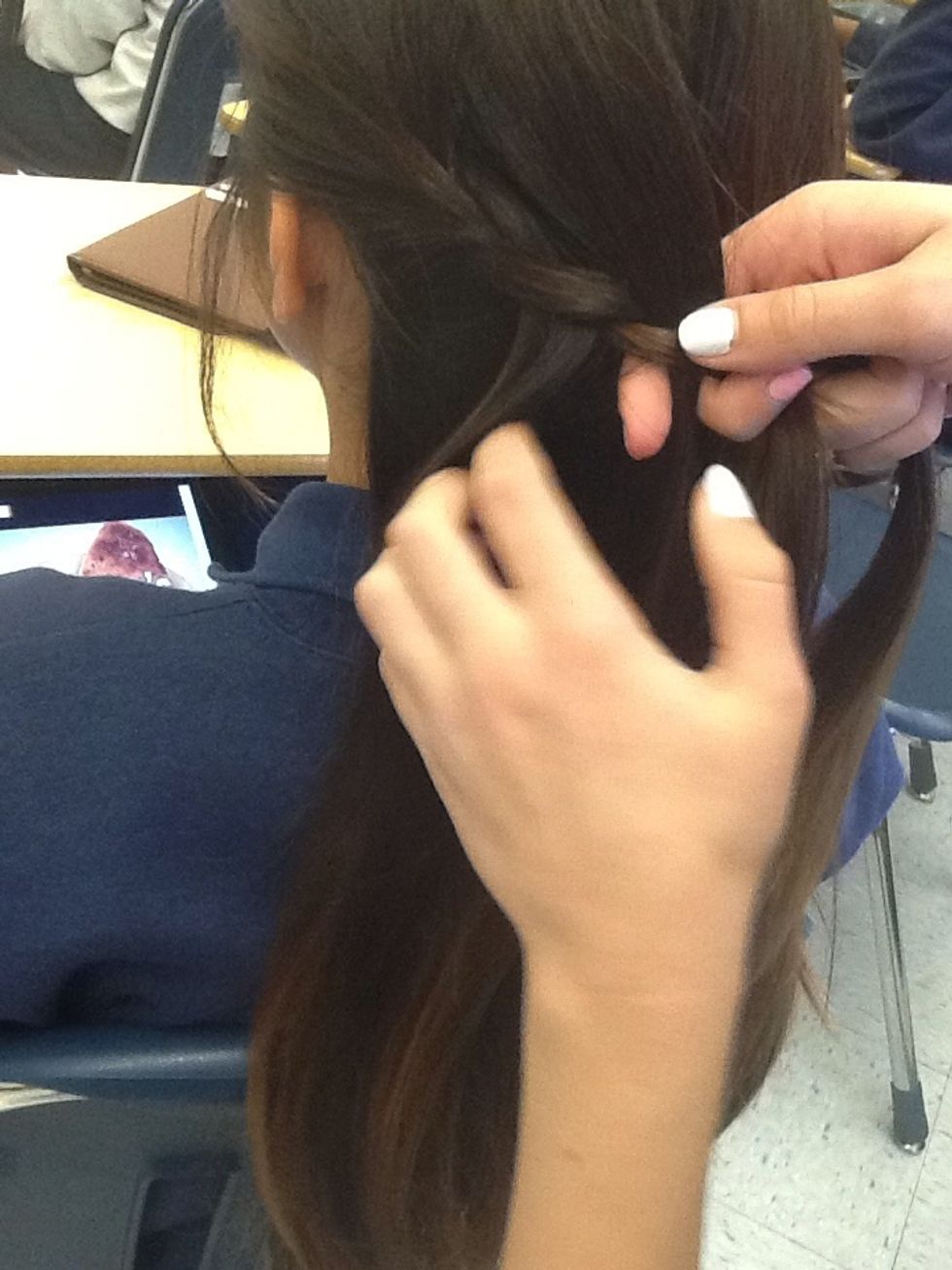 Then, take a piece from all of your hair and add it to what you're braiding.