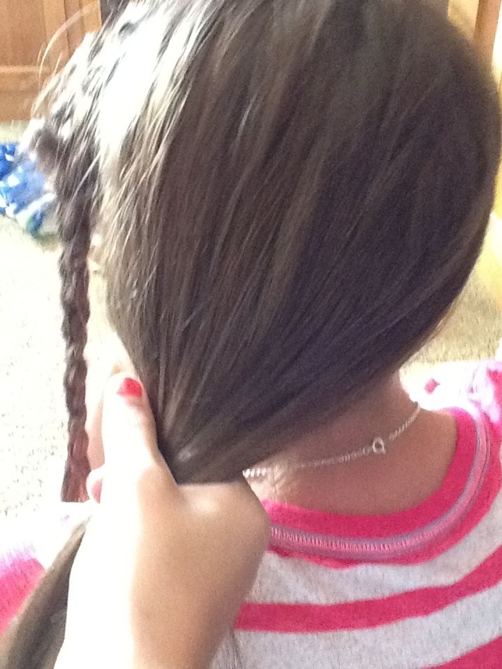 Then take all hair and pull it to one side