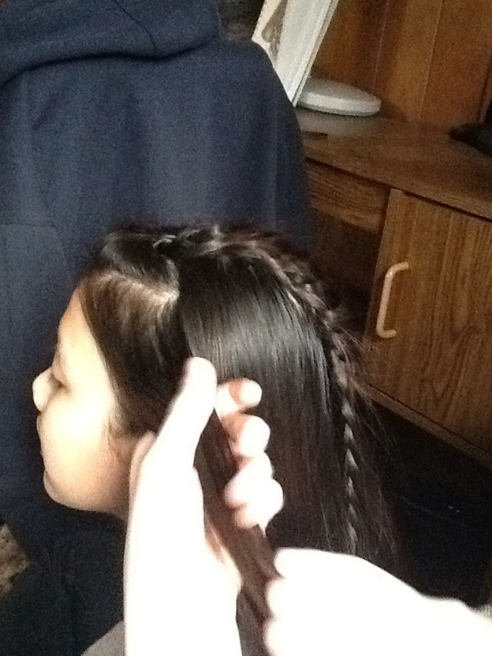 Then take another small section of hair from right below the one you just did.