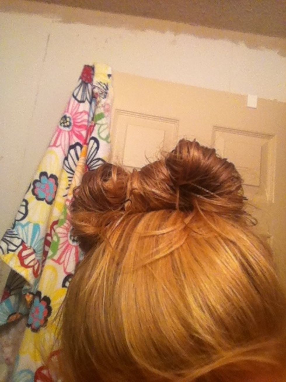 Then take left over hair and flip it over the middle of the bun!(: and bobby pin it down!