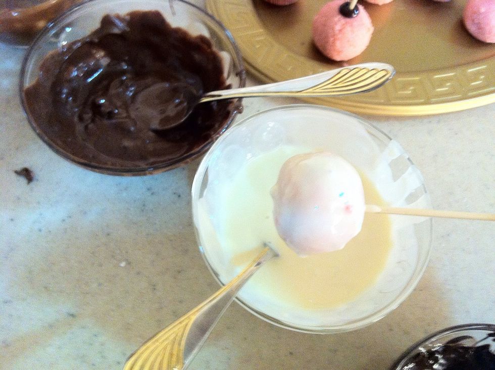 Then take one by one and dip it or cover it by using spoon with the chocolate