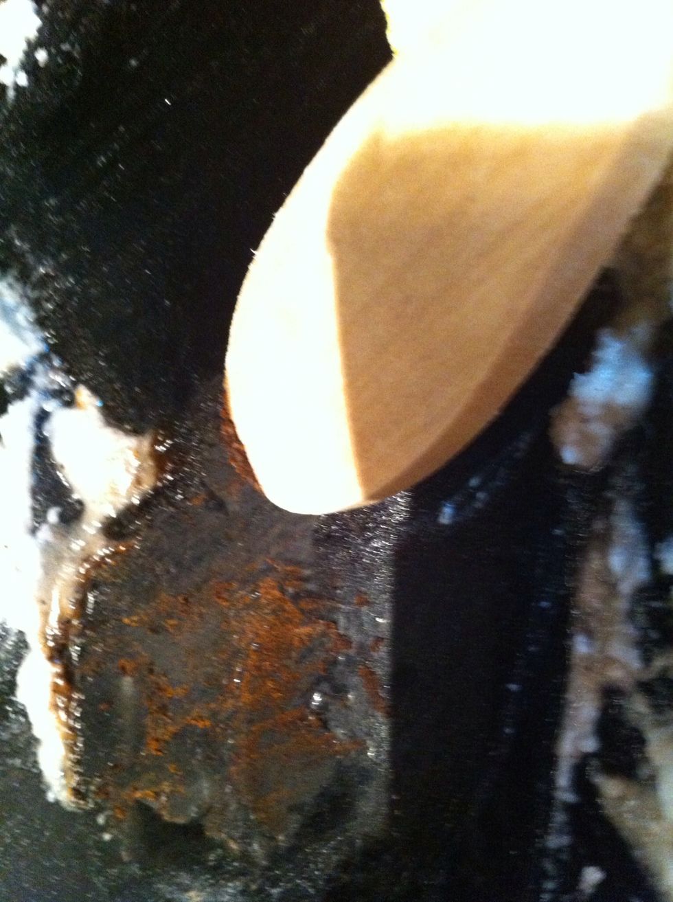 Then take out a wooden spoon...(to prevent scratching)...and start scraping...