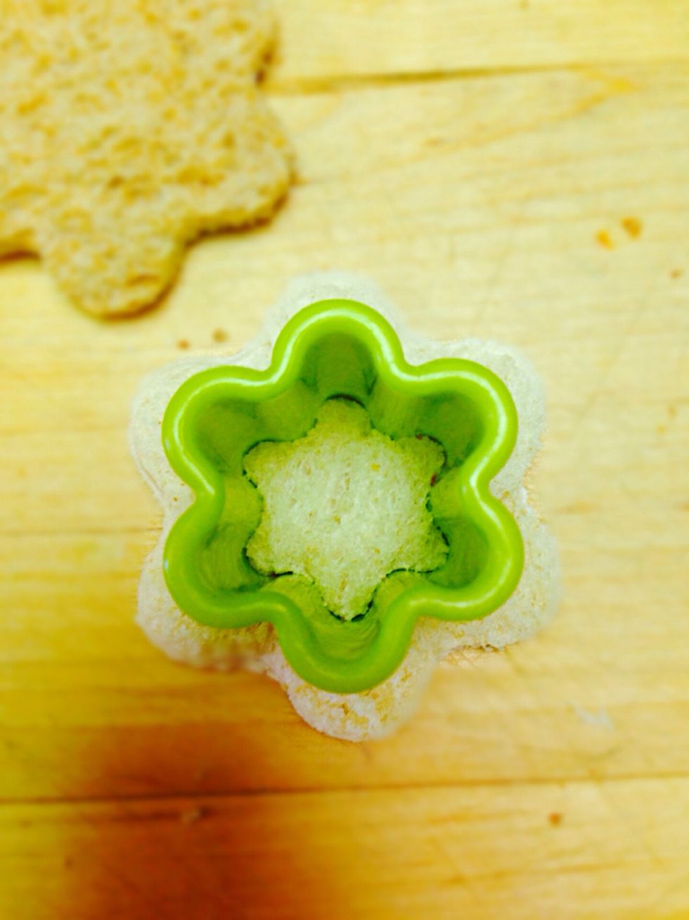 Then take smaller cutter and cut in the middle of the flower (it doesn't have to be a flower shape. You can make circle shape in the middle)