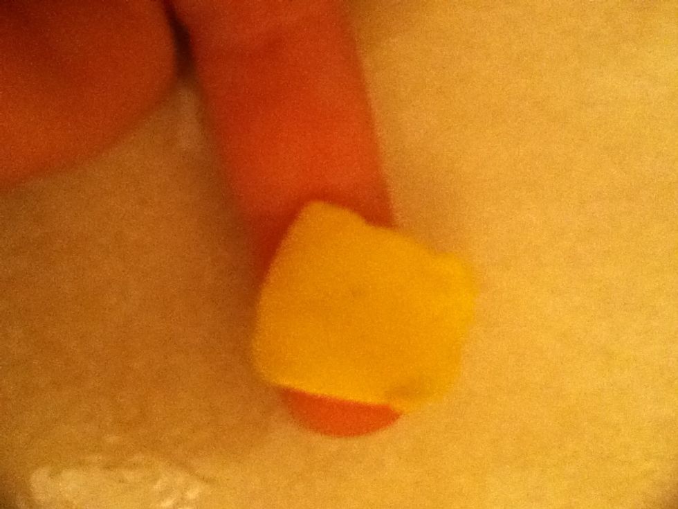 Then take some yellow playdoh for the cheese . To make roll it the cut it with a knife every side should be the same length