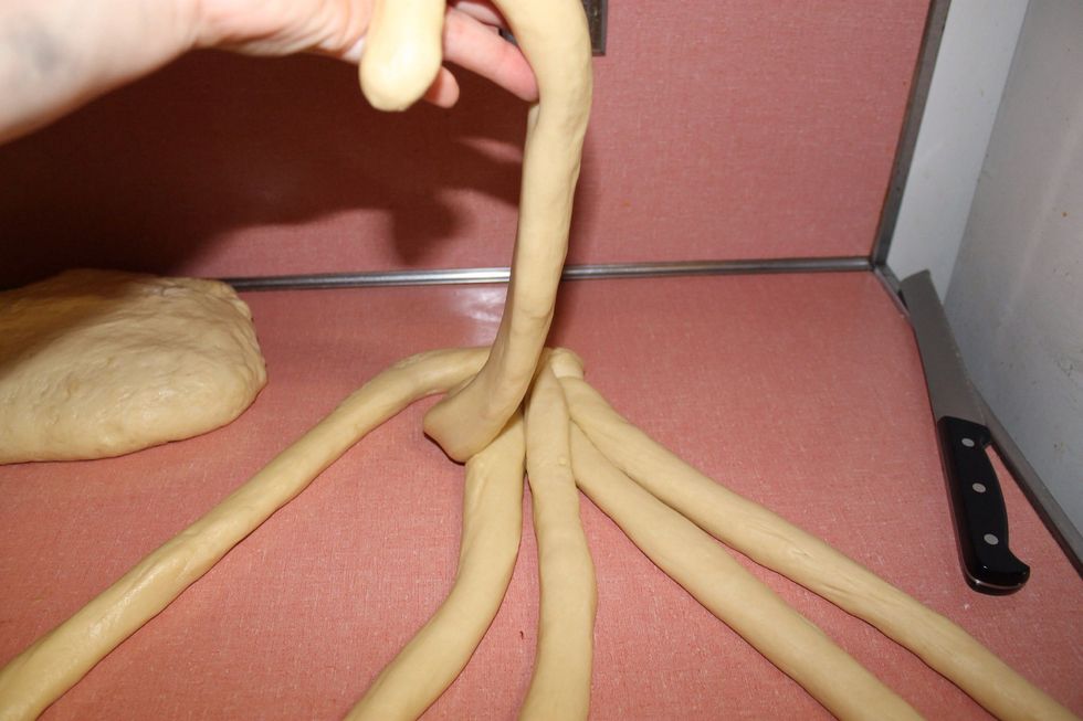 Then take the 2nd outermost strand from the left and cross it all the way to the right