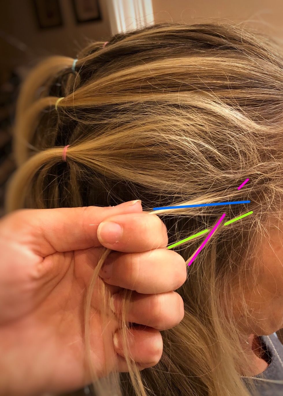 Then take the green (right) strand and cross it under the pink (middle) strand.