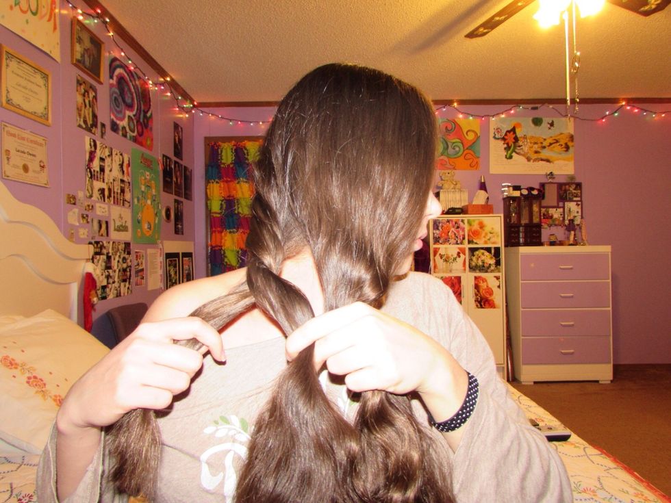 Then take the left-most section and cross it over the middle. Keep doing this until you reach the end of your hair or until you can not braid any longer and tie it off with an elastic or hair tie.
