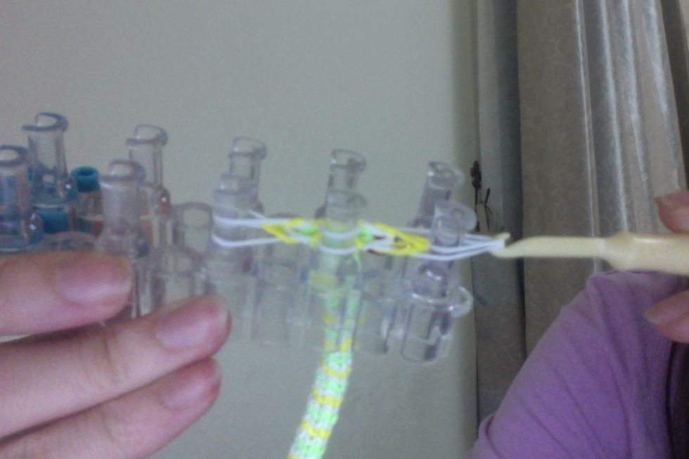 Then take the right peg's rubber bands,