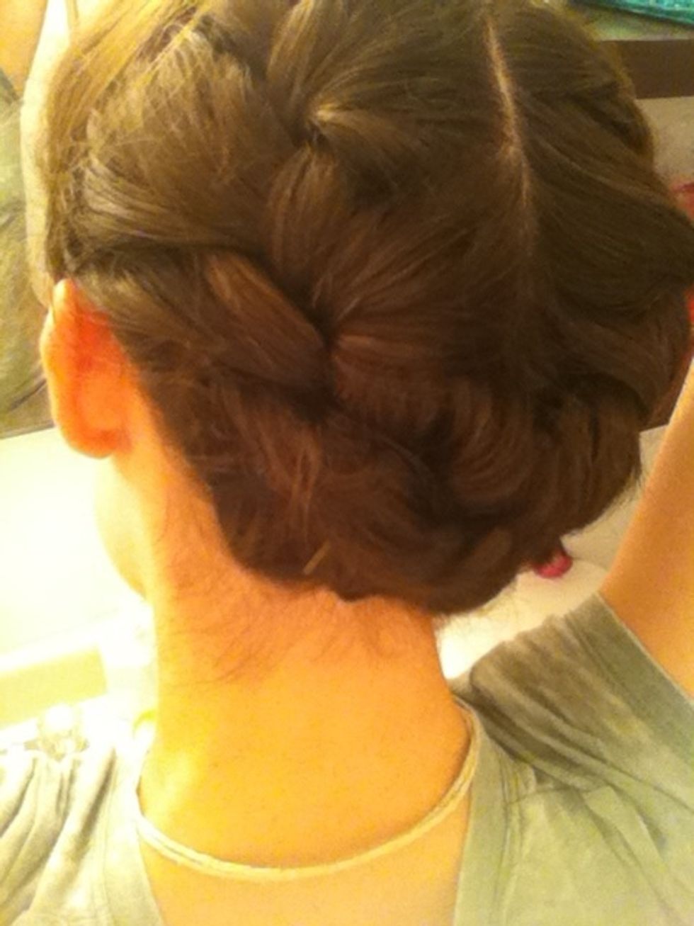 Then take the right side and pull it over the left. Tuck it a little under the left braid. Make sure your pins are secure!!