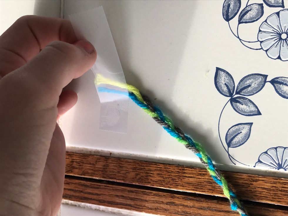 Then take the top where the tape was and hot glue as well