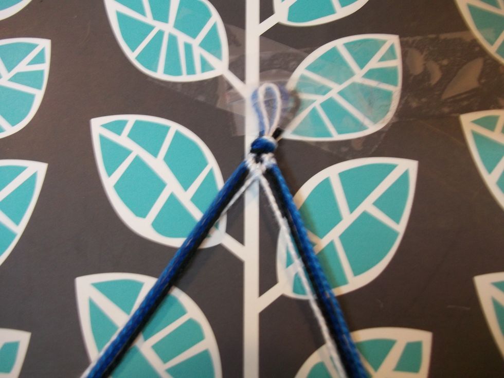 Then take the two strings that you just used to tie knots and tie them together using step 8 and 9.
