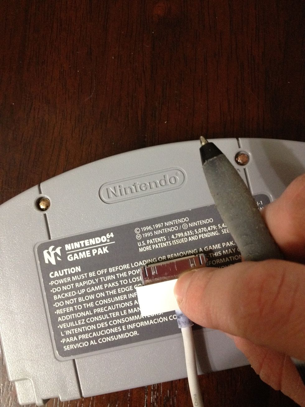 Then take the USB cord and with a pen, mark down where you'd like the charger to go.