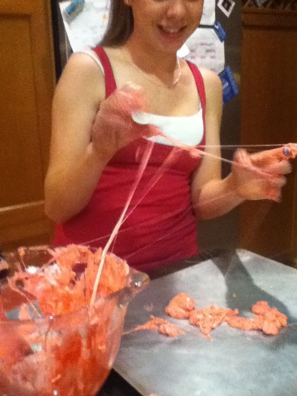 Then take them out and Then flatwn the marshmallow on a pan