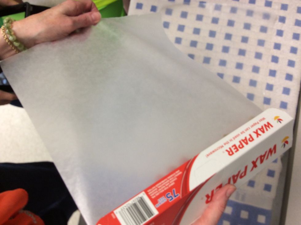 Then take two big pieces of wax paper