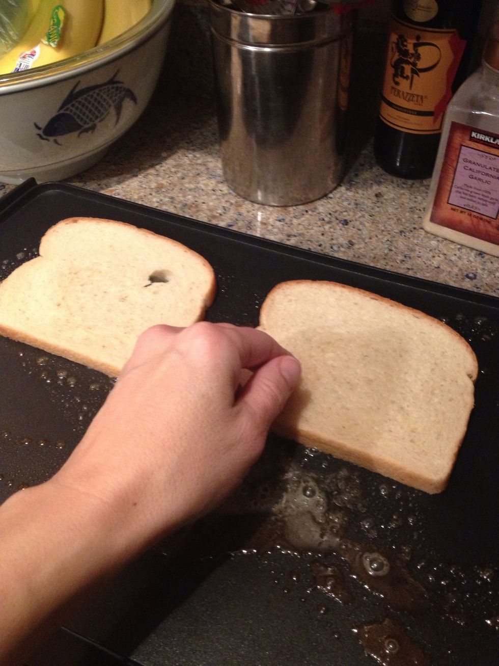 Then take your bread slices and lay them down on that butter like this....