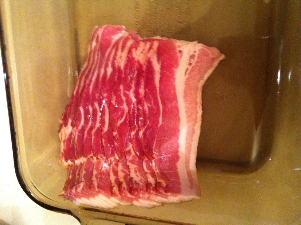 Then take your choice of bacon and cut the strands in half.