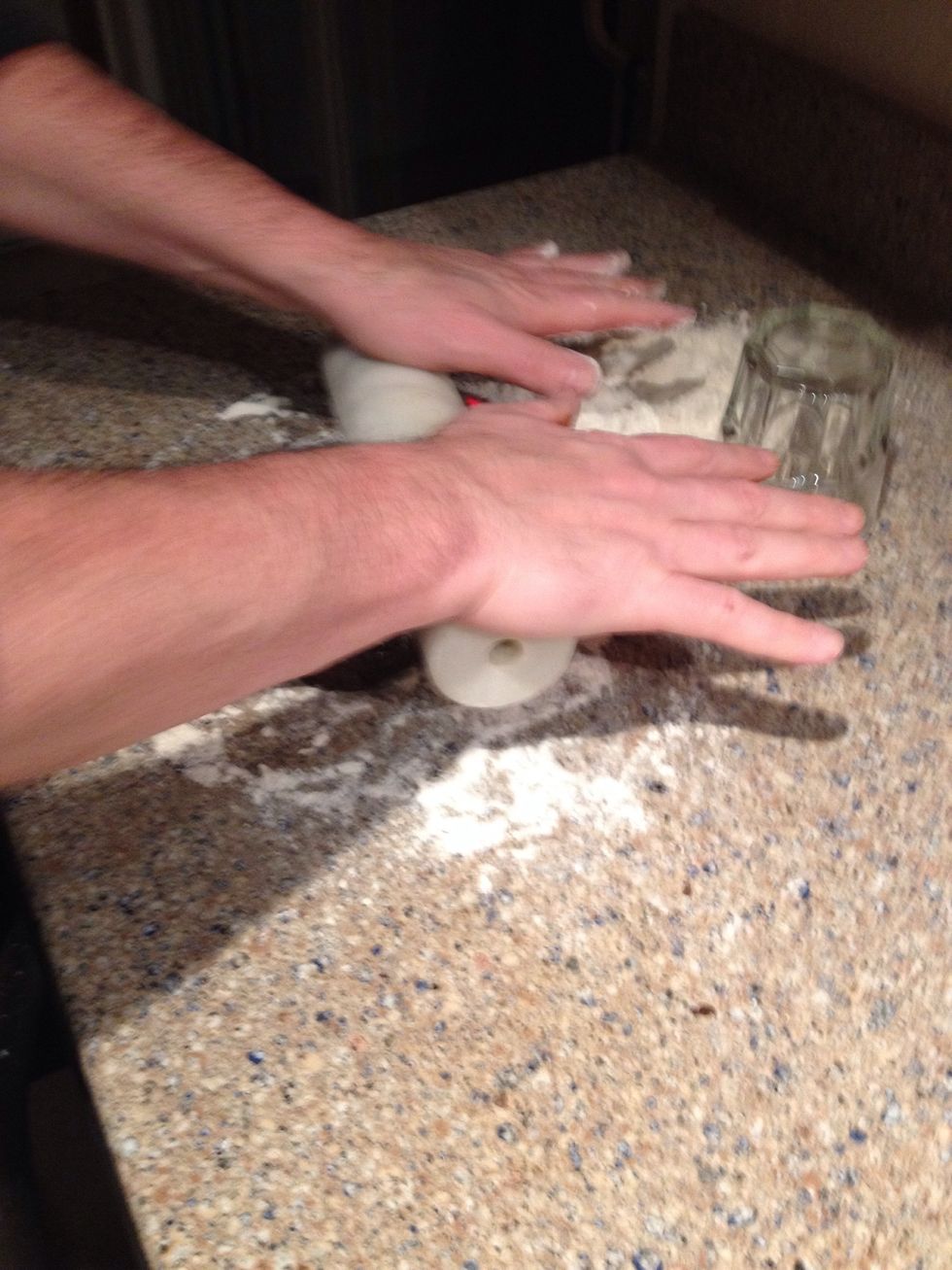 Then take your rolling pin out and flatten to about an inch in thickness.