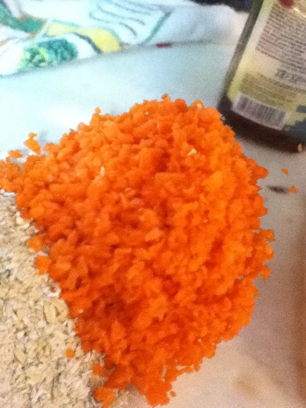 Then, take your two washed and peeled carrots, and run them through the processor. They should look like this.
