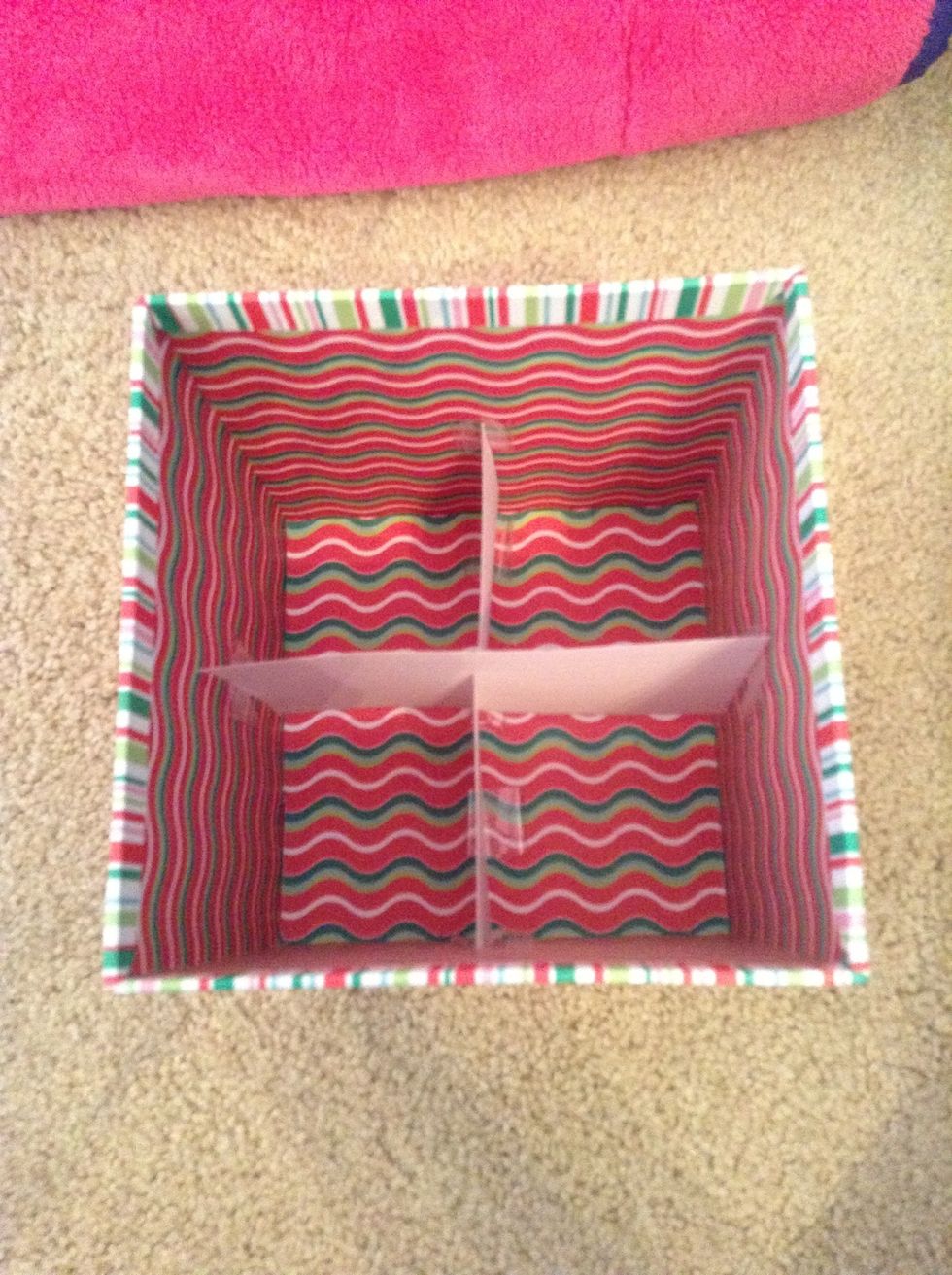Then, taking your other index card, you want to insert it in the slit carefully and let it rest on the tape. Make sure your card is inserted all the way.