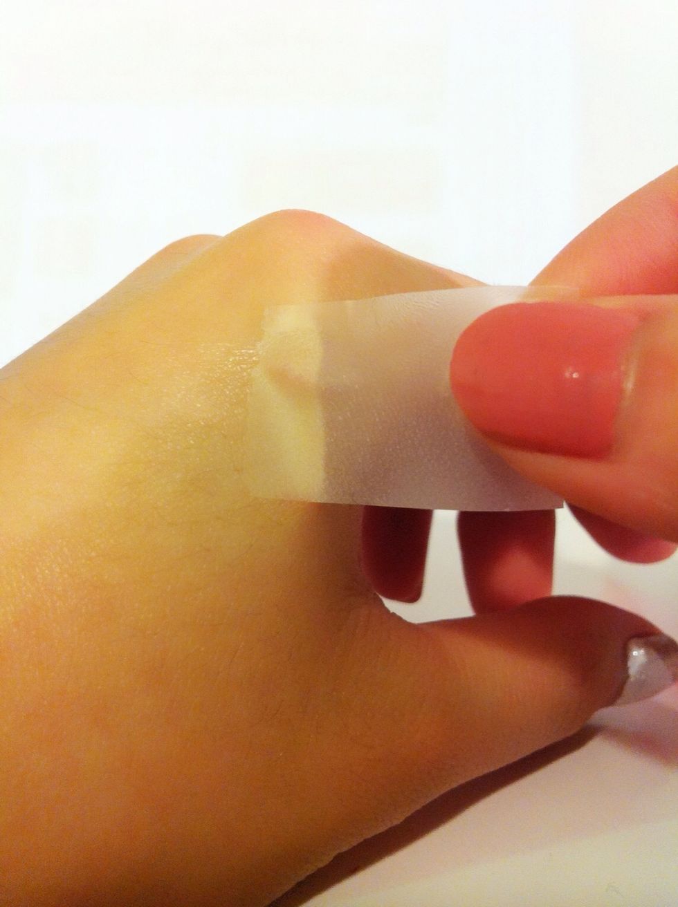 Then, tap it on your skin several times to make it less sticky, this is to prevent the polish from sticking off by too sticky tap.