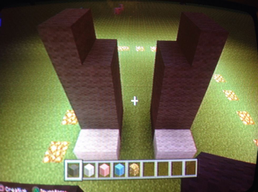 Then the back paws three blocks up . But then add one more Gary blocks to the right sides of the legs.