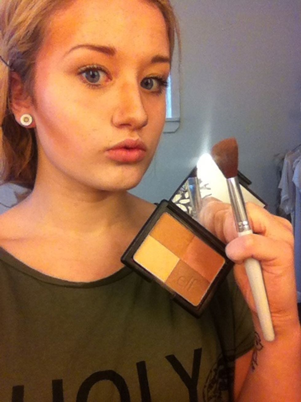 Then the bronzer and bronzing brush. Apply it on the sides if you're nose, under you're cheekbones and in the sides of yore forehead.