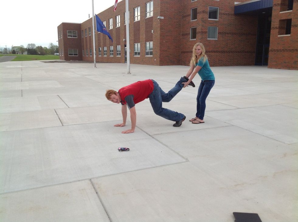 Then, the person bending over needs to give the person behind them, their foot.