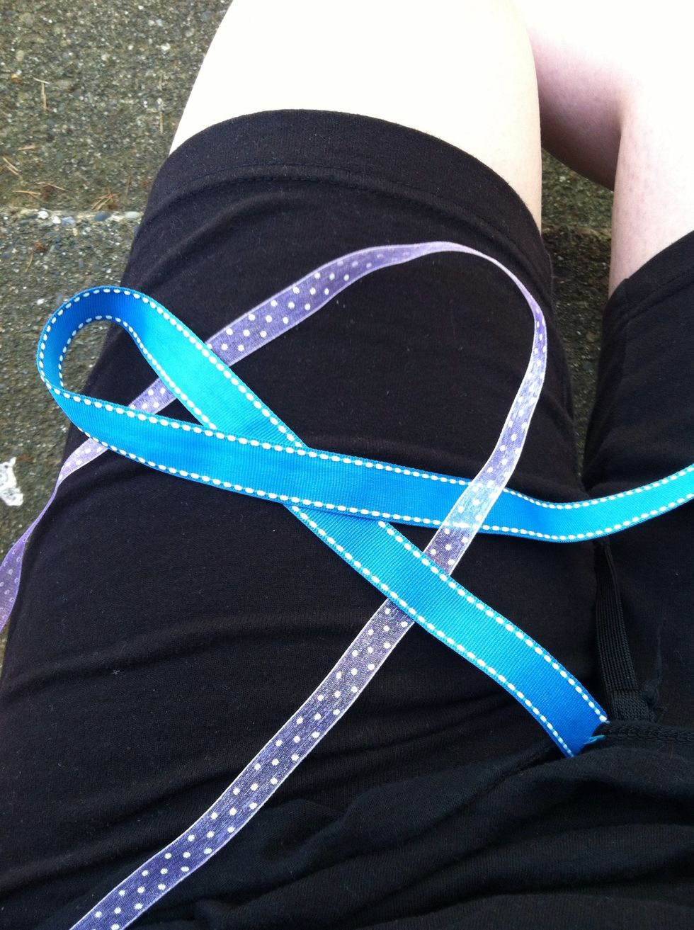 Then the tail of the second piece will go UNDER the tail of the first.