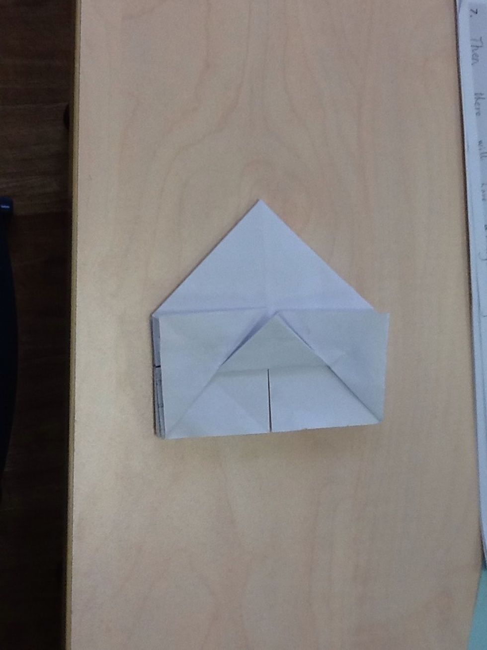 Then,there will have a triagal and fold the triagal in the both side.