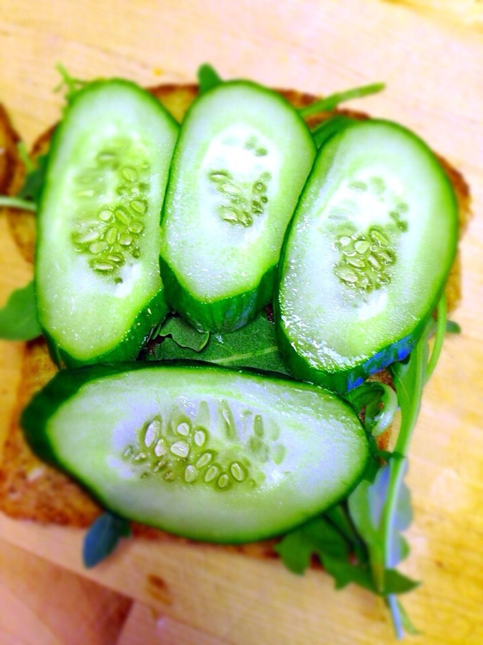 Then thin slices of cucumber