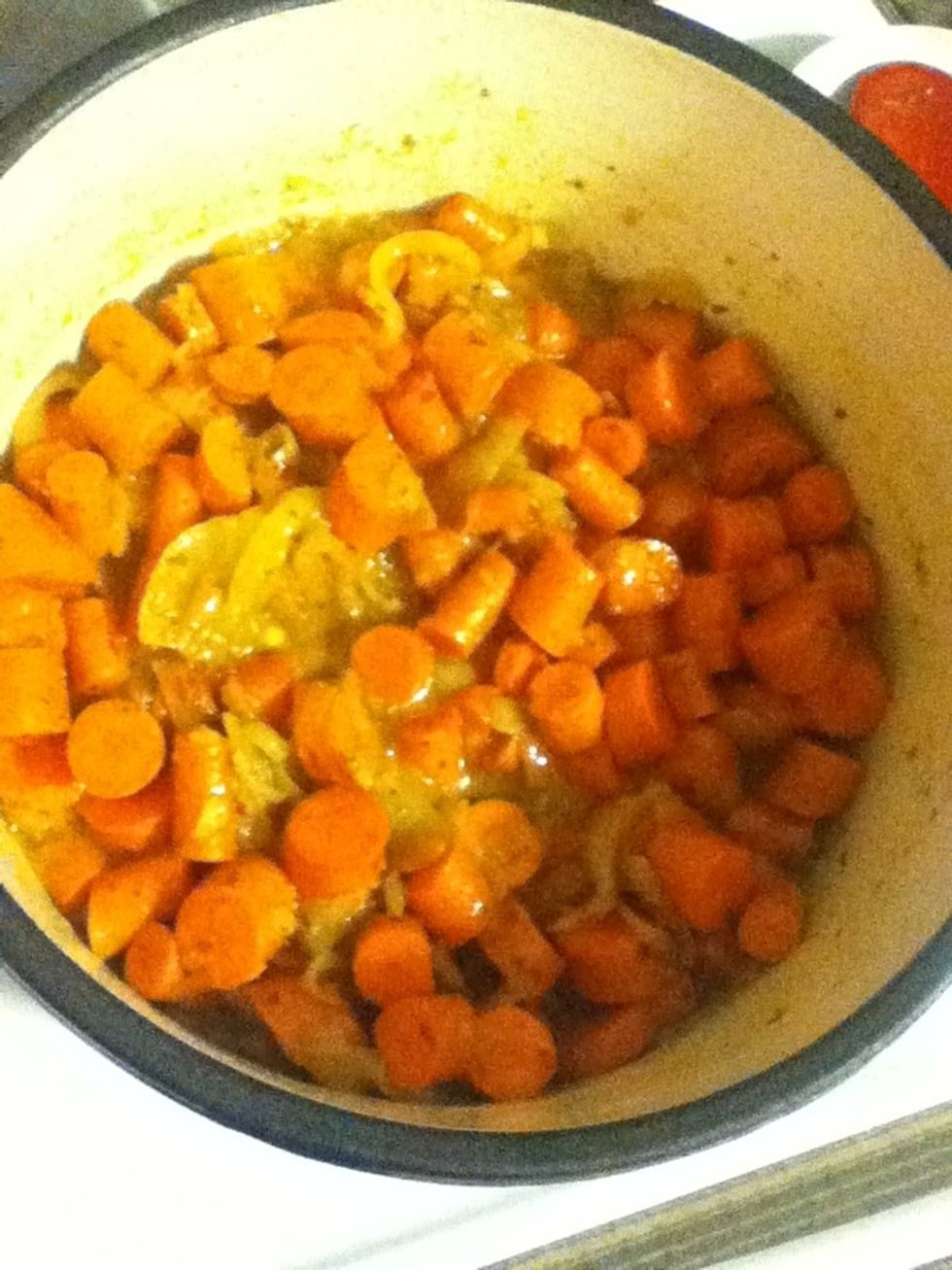 ...then those carrots, and stir to combine. Turn your heat back up, put the cover on and let those carrots get nice and soft. This could take ten or fifteen minutes.