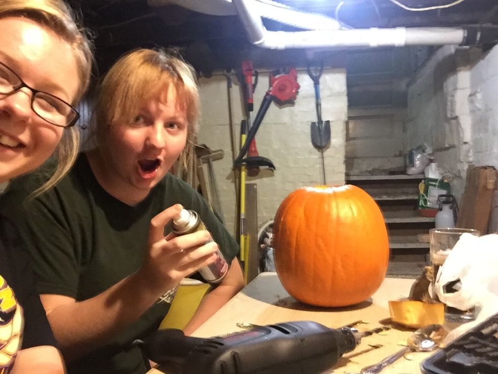 Then to add a little something spray some glitter on your pumpkin.