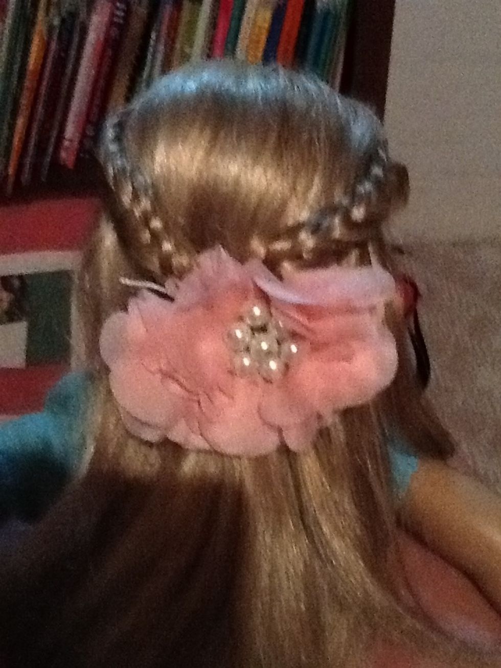 Then to hide the bobby pins put a flower or a pretty clip over the pins