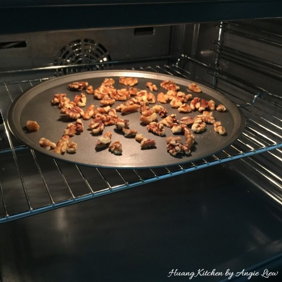 Then, toast the walnuts in an oven preheated to 180 degree C for about 8 to 10 minutes until they are nicely brown. Toasting brings out the flavour of the nuts.