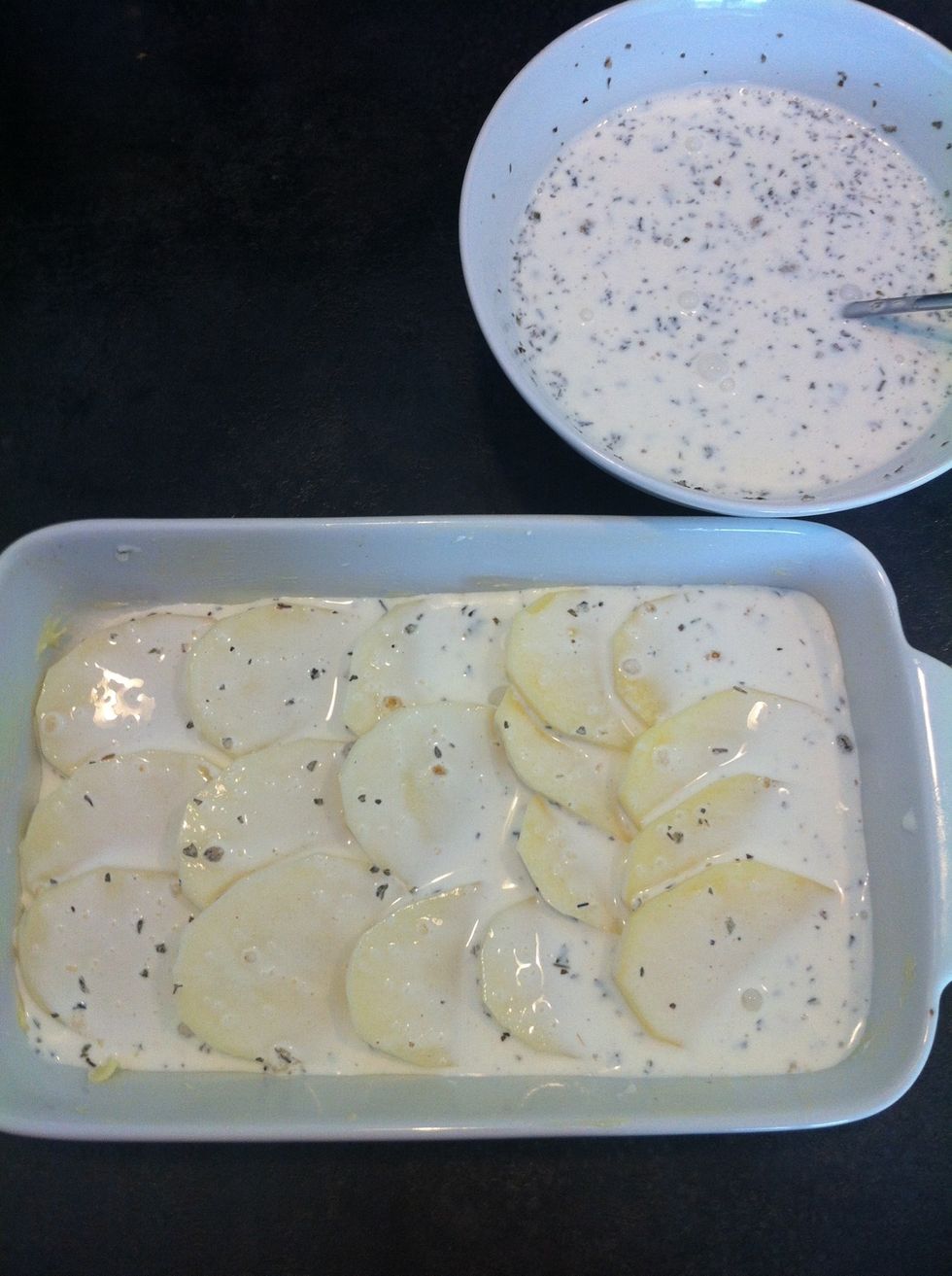 Then top it with the mixture. Then add again a layer of potatoes and top it with the mixture. Go on for about 3 or 4 layers.