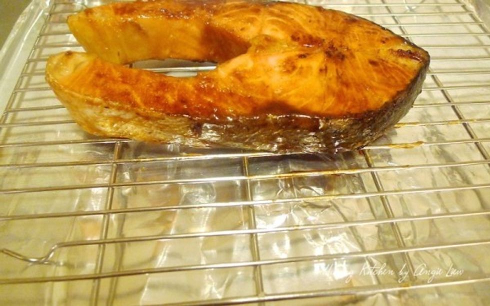 Then transfer the seared salmon onto a low rack above a baking dish lined with aluminium foil.