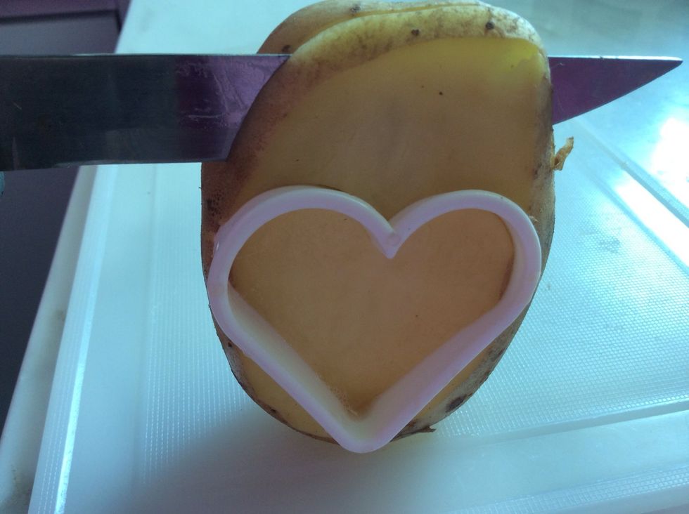 Then trim off about 1-2cm of potato like this.