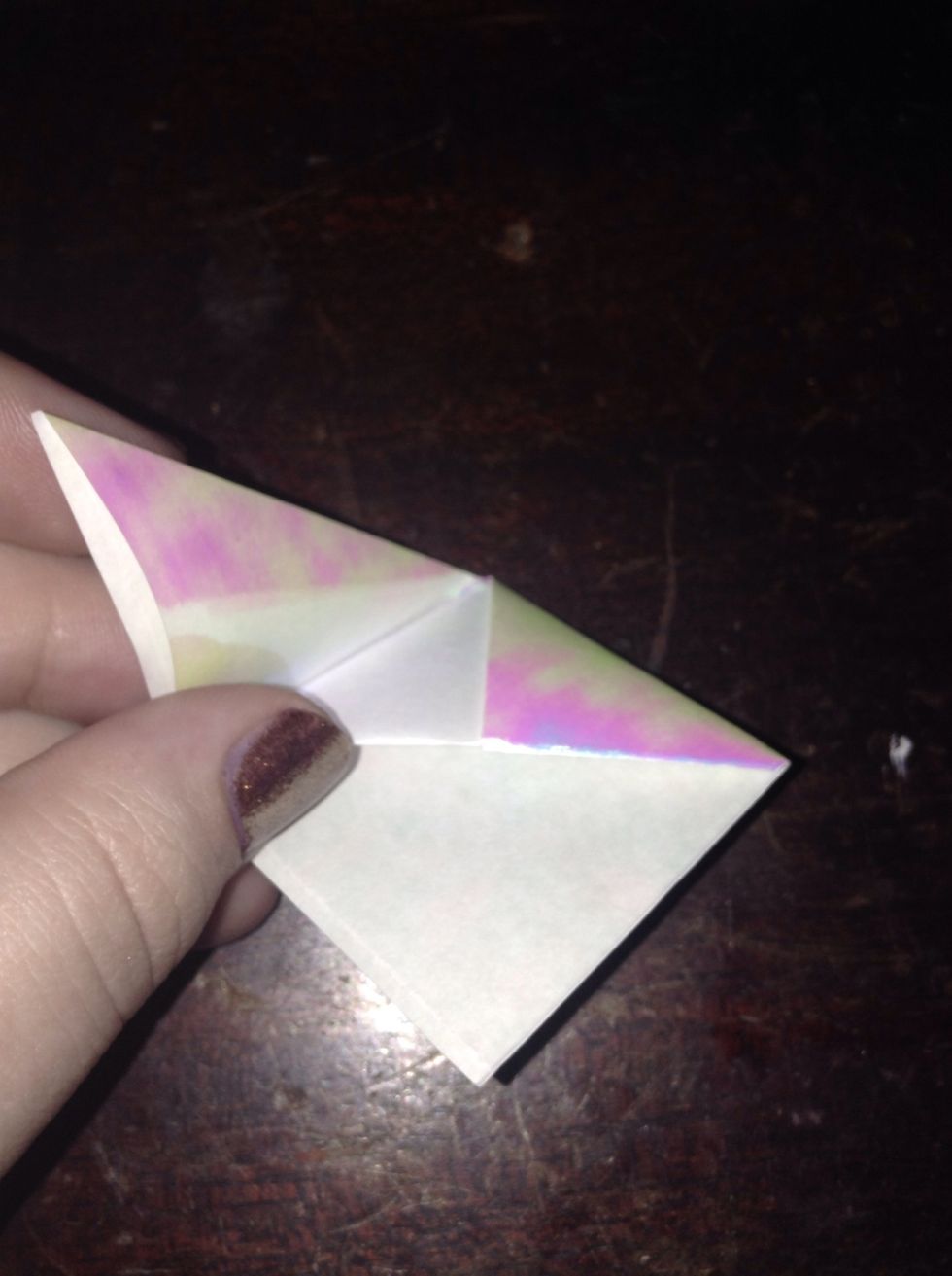 Then tuck corner underneath the last fold.