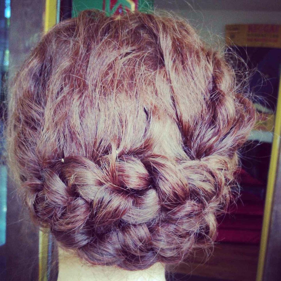 Then tuck the tails of the braids in so it doesn't show. Voil\u00e1!