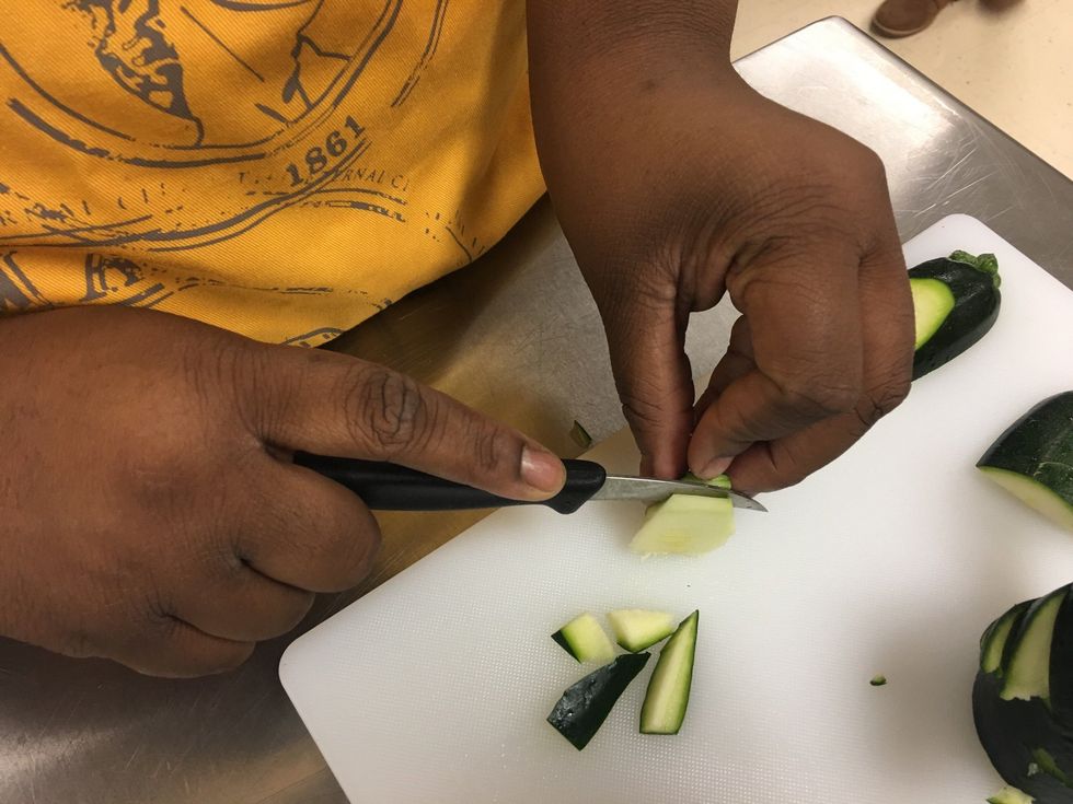 Then turn it upward and cut of the vegetable part of the Zucchini and leave the skin, with just a little vegetable on it.