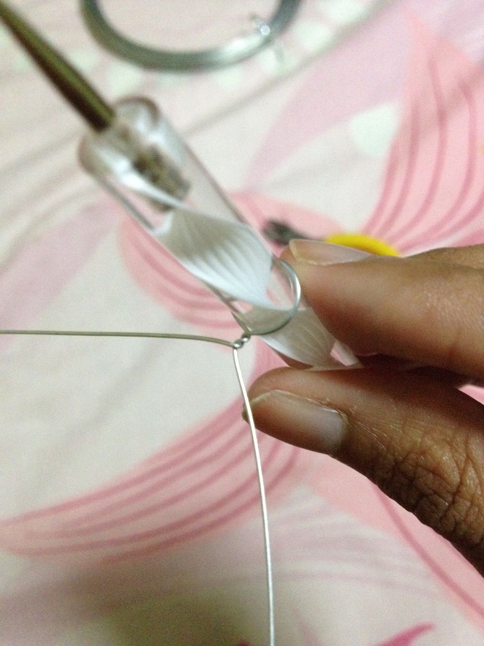Then twist 2-3 times to secure the round shape. MAKE SURE the stem of the petal is twisted horizontally or else the applying the nail polish later will be difficult.