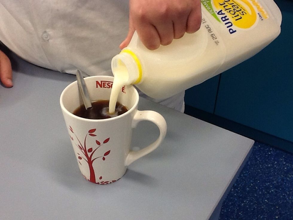 Then u add the milk With out over filling the cup