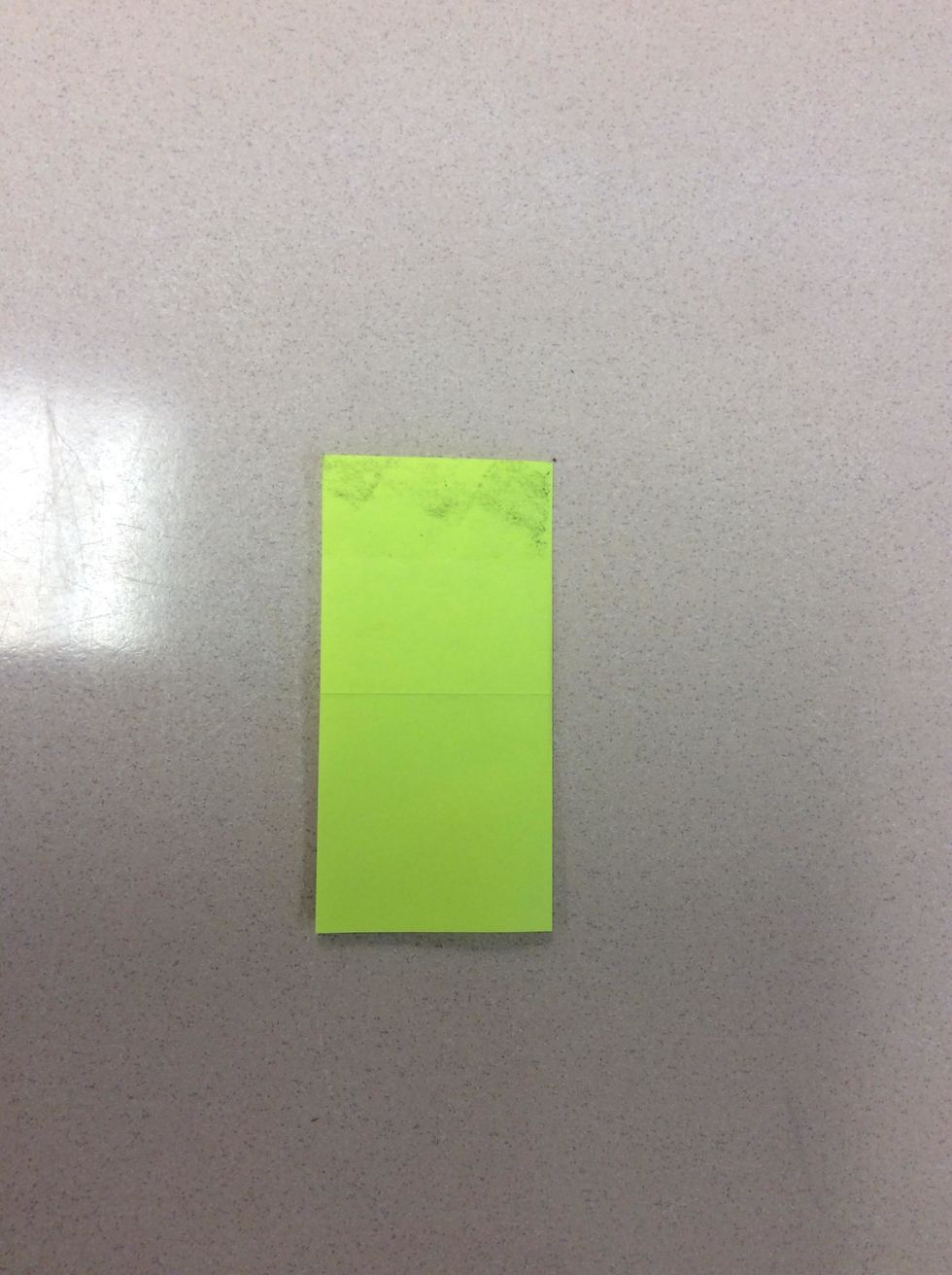 Then, unfold it. Fold the right side to the left side, vertically.