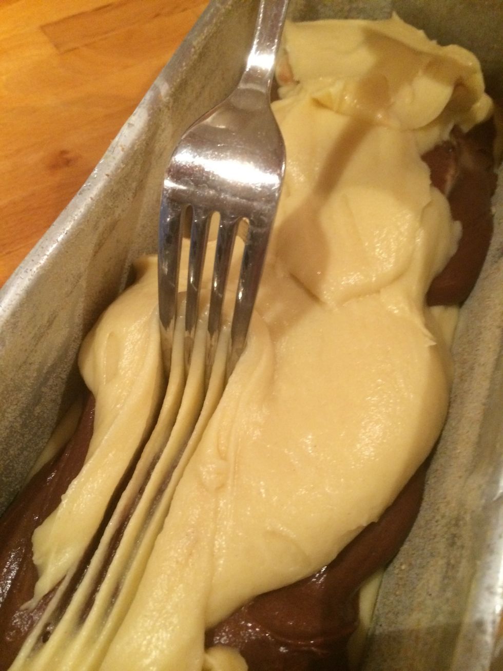 Then use a fork to make a pattern in your cake. Be careful not to blend the to different batters too much.